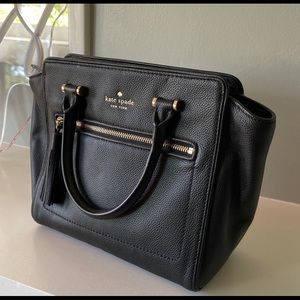 Kate Spade Purse with shoulder straps. Has small pocket on the inside of the bag